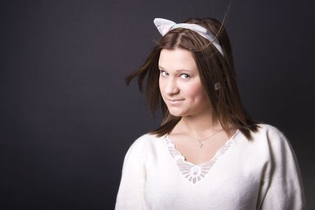 Portrait of a young beautiful looking like a catの写真素材
