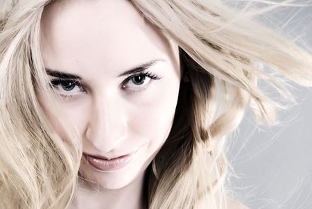 Portrait of a young beautiful blonde being serious の写真素材