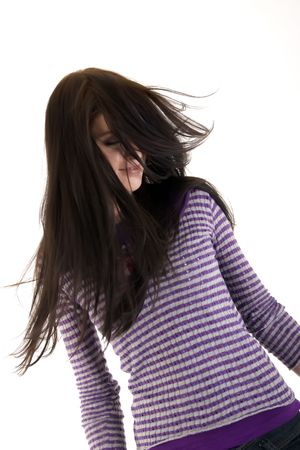 Portrait of a young beautiful brunette over whiteの写真素材