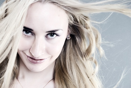 Portrait of a young beautiful blonde smilingの写真素材
