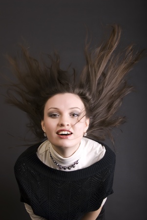 Portrait of a young beautiful brunette being full of happinessの写真素材