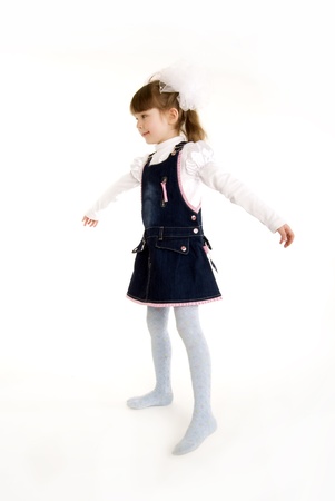 Beautiful little girl as if flyingの写真素材