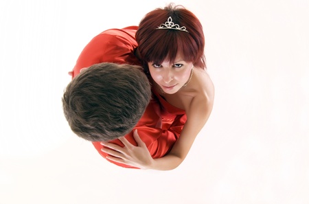 Young couple in red embracing as a concept of love and passionの写真素材