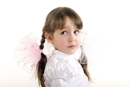 Beautiful little girl glancing backの写真素材