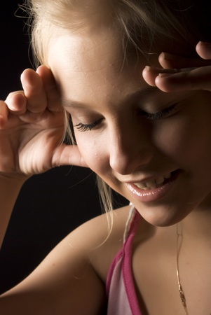 Portrait of a young beautiful blonde with closed eyesの写真素材