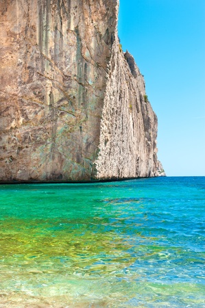 Bright view of calm wild beach of spanish coast line. Clean Mediterranean sea. Beautiful rock. Paradise for peopleの写真素材