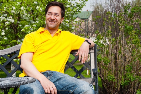 Middle Aged Man Relaxing In Gardenの写真素材