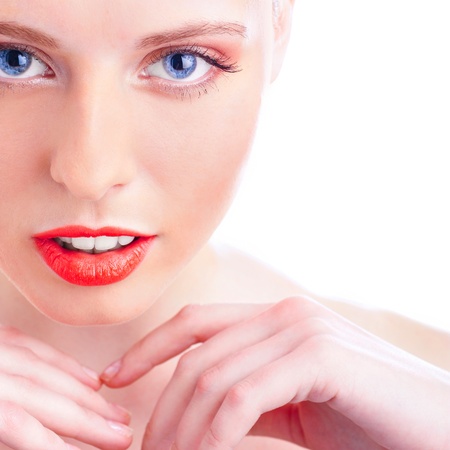 Close-up portrait of sexy caucasian young woman with beautiful blue eyes and red lipsの写真素材