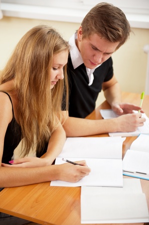 Portrait of a young group of students paying attention and doing exercises in class.の写真素材