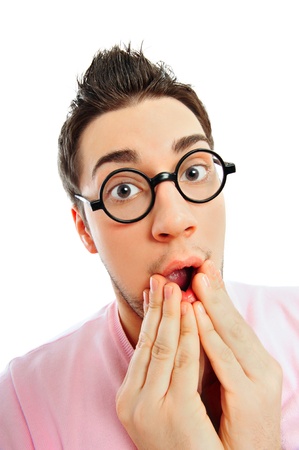 View from above of man in glasses looking at camera with hands on opened mouth wearing pink glamorous clothesの写真素材