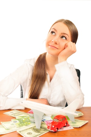Closeup portrait of young woman deciding between car and aircraft trip on vacation. Looking at copyspace. Also rent a car on vacation concept.の写真素材