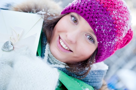 Beautiful young lady having fun outdoors in winterの写真素材