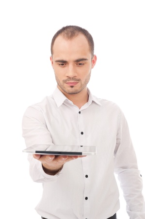 Man excited holding tablet pc isolated on white background. Cheerful happy fresh Caucasian Male modelの写真素材