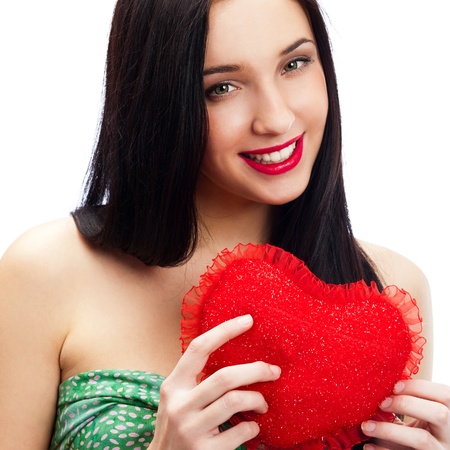 Portrait of attractive smiling woman with heart on white backgroundの写真素材