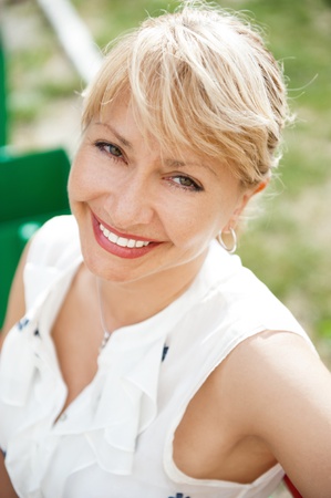 Portrait of a sexy  young female smiling in a park - Outdoorの写真素材
