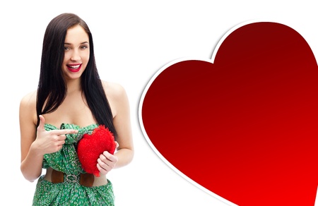 Young happy smiling woman with heart symbol, isolatedの写真素材