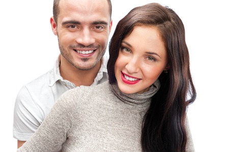 Portrait of young couple standing together isolated against white background. Mortgage conceptの写真素材
