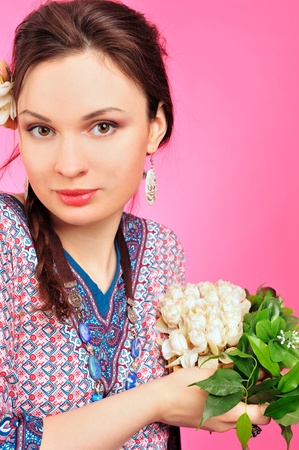 Portrait of a beautiful young girl in Asian clothing. の写真素材