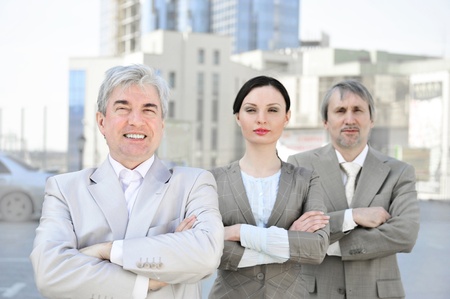 Portrait of three business people outside. Outside background.の写真素材