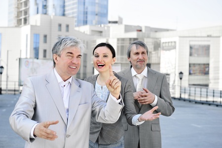 Portrait of three business people outside. Outside background.の写真素材