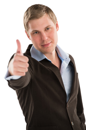A young executive giving you a thumbs up while isolated on a white backgroundの写真素材