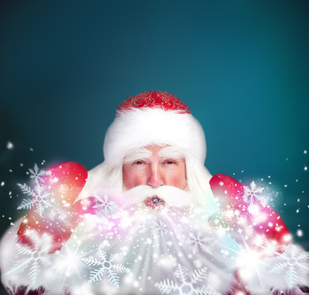 Christmas theme: Santa Claus blowing snowflakes from his arms. Designed Posterの写真素材