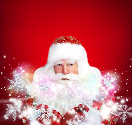 Christmas theme: Santa Claus blowing snowflakes from his arms. Designed Posterの写真素材