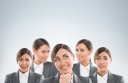 Group of business women clones with different emotionsの写真素材