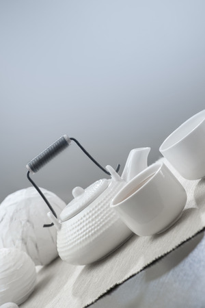 Teapot and cups on table at comfortable relaxation loungeの写真素材