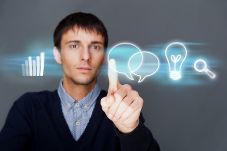 Business man working with his modern computer and virtual interface. Merge of technologies concept