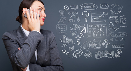 Young business woman thinking of her plans の写真素材