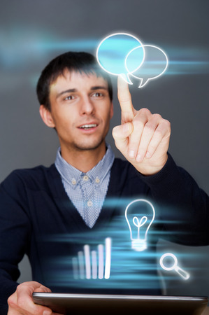 Business man working with his modern computer and virtual interface. Merge of technologies conceptの写真素材