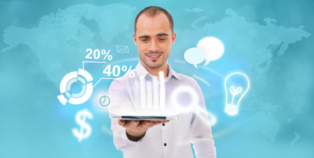 Adult business man holding tablet computer and different icons of his tasks and functions are flying from screenの写真素材