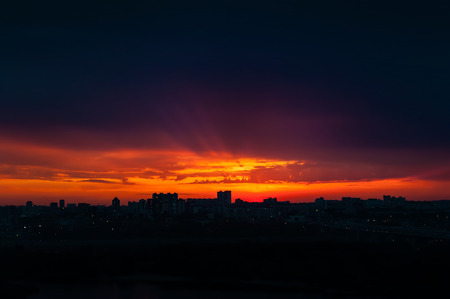 Abstract city silhouette against dramatic sky