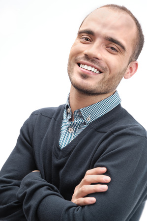 Portrait of a handsome young business man looking at camera smiling relaxing isolatedの写真素材