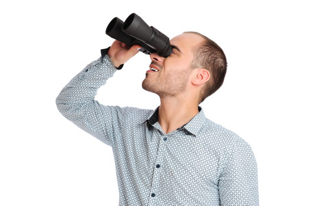 Business man with binoculars isolated on white backgroundの写真素材