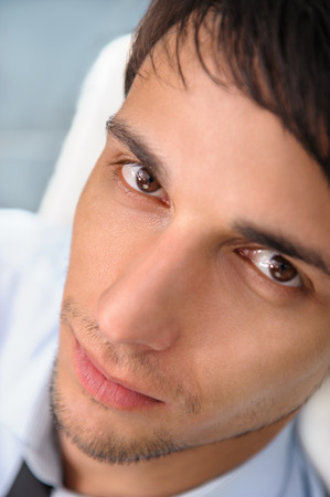 Closeup portrait of confident young businessmanの写真素材