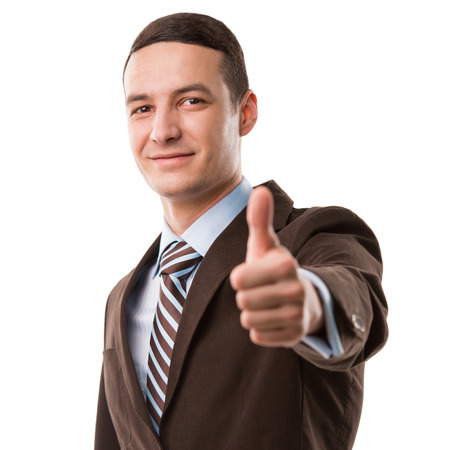 Executive giving thumbs up isolated on white backgroundの写真素材