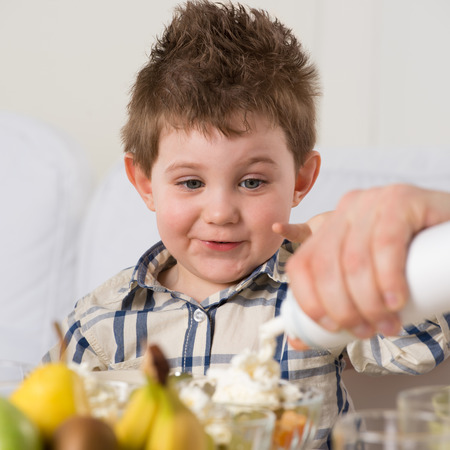 Child on breakfast - having fun の写真素材