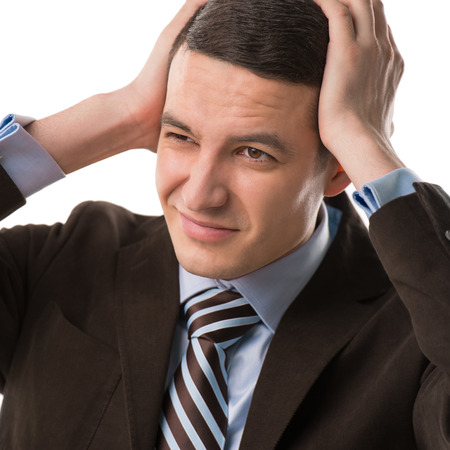 Business man holding his head. Headache or office rush conceptの写真素材