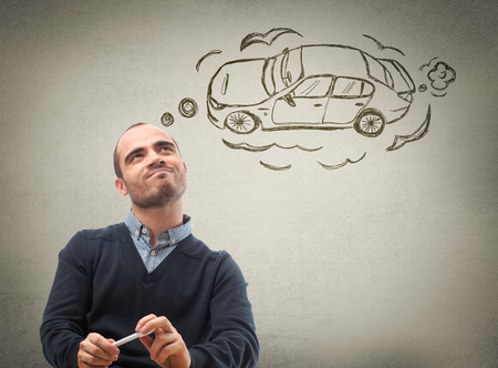 Car credit concept. Man dreaming about carの写真素材