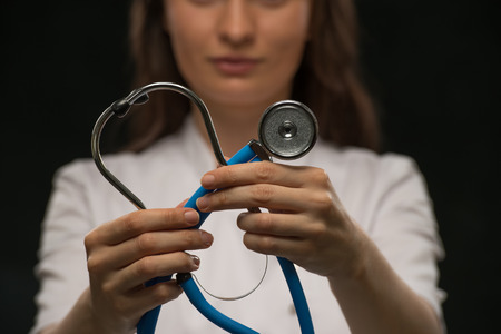 Female Doctor holding stethoscopeの写真素材