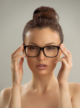 Portrait of hot sexy naked woman wearing glassesの写真素材