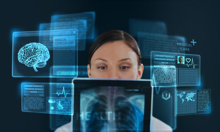 Female medicine doctor working with modern computer interface as conceptの写真素材