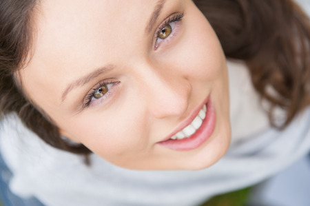 Cute woman rest in the park and smiling. Overhead viewの写真素材