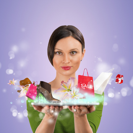 Woman shopping online using her tablet computerの写真素材