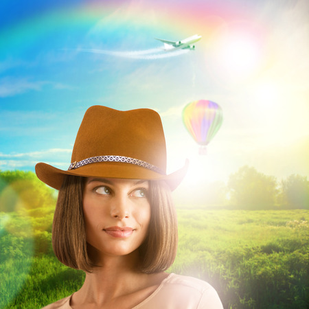 Young pretty woman dreams about better worldの写真素材