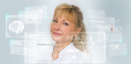 Calm doctor touching a medical interface in the hospitalの写真素材