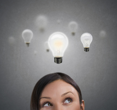 Woman with lamps overhead, idea conceptの写真素材