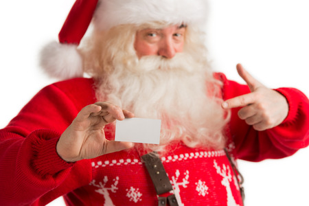 Portrait of happy Santa Claus showing blank business card isolated on white background. Call Santa Conceptの写真素材